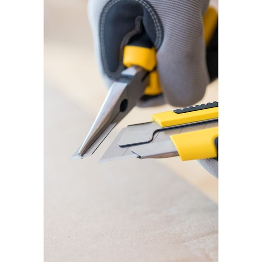 STANLEY 0-10-425 utility knives and pliers with yellow handles, close-up photography.