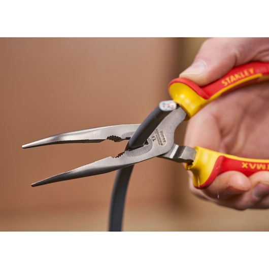 STANLEY 0-84-008 long nose pliers with yellow and red handles gripping a black wire, close-up.