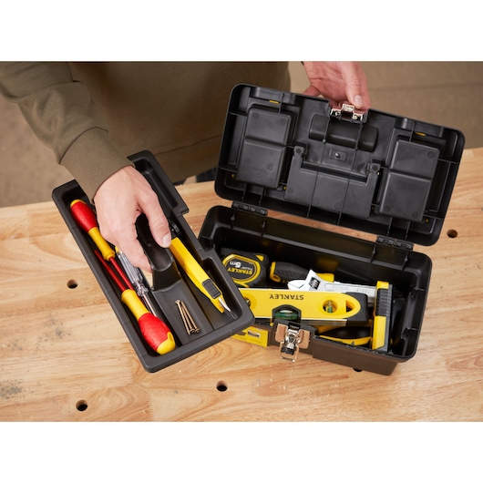 STANLEY 1-92-064 tool box open on table, showing tray with tools and interior compartment.