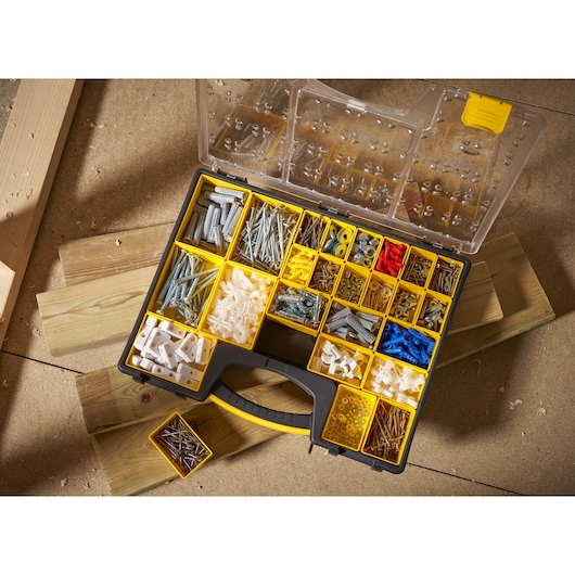 STANLEY 1-92-748 organizer box with yellow compartments, filled with assorted fasteners, photographed from above.