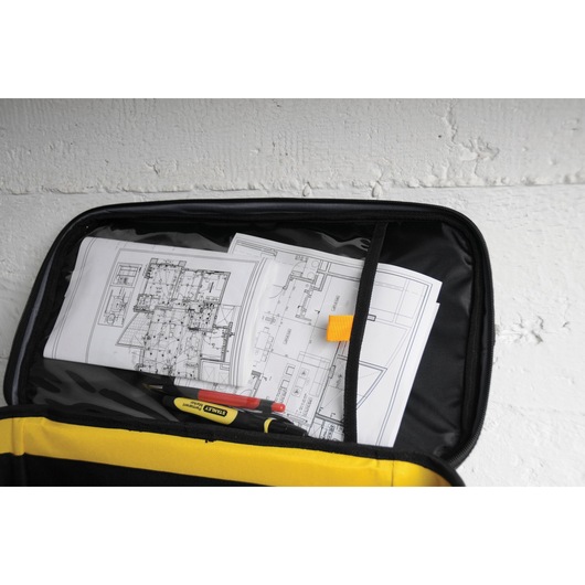 STANLEY 1-96-193 tool bag photography, open top view with organizers holding blueprints and writing tools.