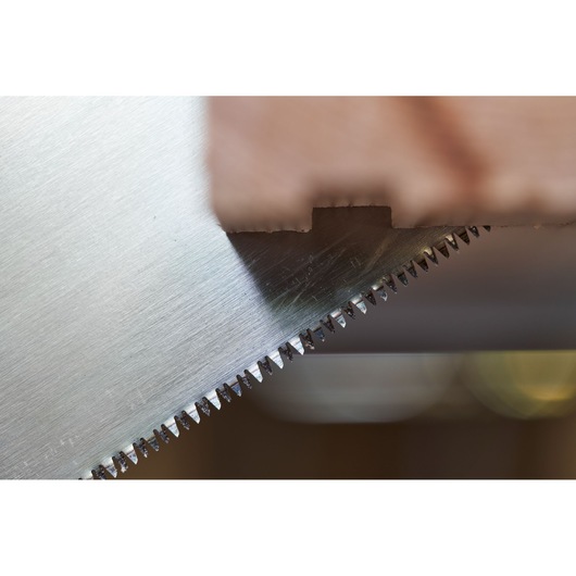 STANLEY 2-15-244 saw blade close-up showing sharp teeth cutting through wood, product photography.