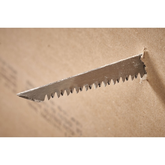 STANLEY FMHT0-20559 saw blade cutting through drywall, close-up side angle.