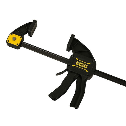STANLEY FMHT0-83237 bar clamp with trigger handle, black and yellow, side angle on white background.