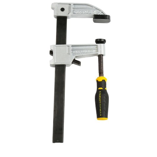 Stanley metal bar clamp with black and yellow handle, used for securing materials in woodworking projects.