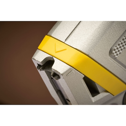 STANLEY FMHT70100-0 close-up photography of silver and yellow tool, featuring textured grip and arrow detail.