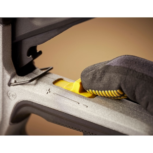 STANLEY FMHT70443-0 photography of close-up of yellow adjustment lever on metallic tool handle.