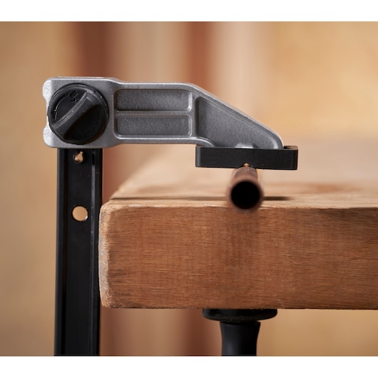 STANLEY FMHT83007-0 photography of pipe cutting tool clamped on wooden workbench, front angle.