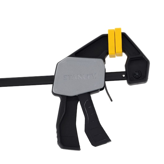 STANLEY FMHT83271-0 photography of trigger clamp with black and yellow accents, side angle on white background.