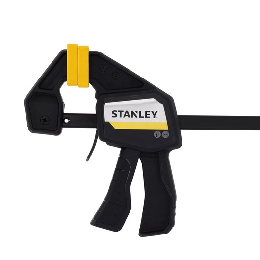 STANLEY FMHT83272-0 photography of black and yellow trigger clamp, front angle on white background.