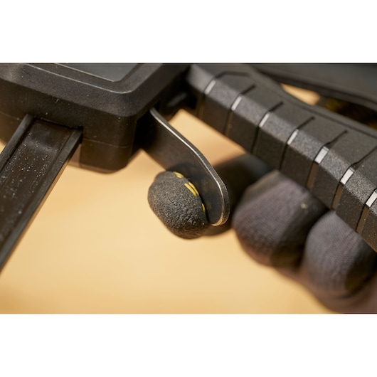 STANLEY FMHT83274-0 photography of black clamp trigger handle, close-up side view.