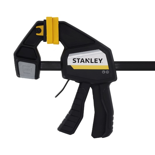 STANLEY FMHT83274-0 photography of black and yellow trigger clamp, side angle on white background.