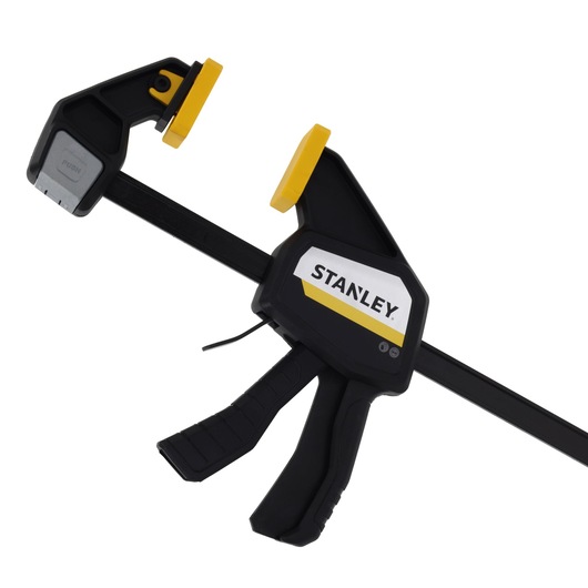 STANLEY FMHT83275-0 trigger clamp, black and yellow, side angle on white background