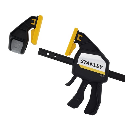 STANLEY FMHT83279-0 photography of trigger clamp with yellow pads, angled view on white background.