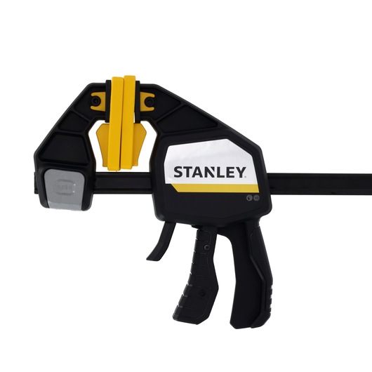 STANLEY FMHT83280-0 photography of black and yellow trigger clamp, side angle, white background.