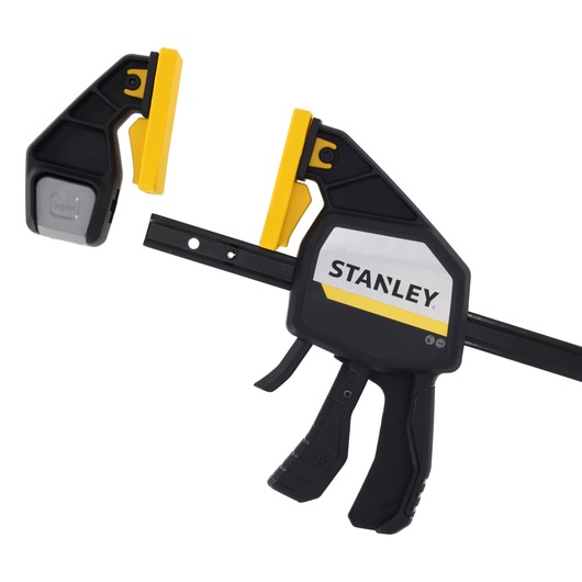 STANLEY FMHT83282-0 photography of black and yellow trigger clamp, side angle on white background.