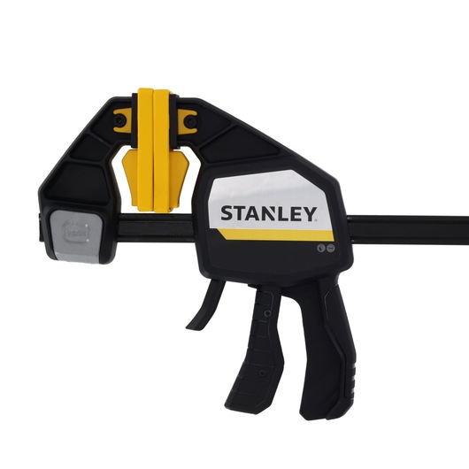 STANLEY FMHT83283-0 photography of trigger clamp, black and yellow, side angle on white background.