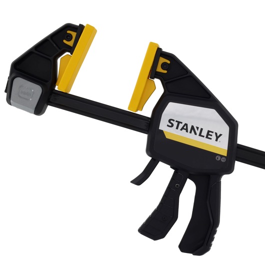 STANLEY FMHT83283-0 photography of black and yellow trigger clamp, front angle, white background.