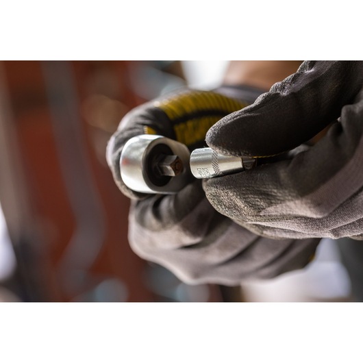 STANLEY FMMT17197-0 socket tool in use, held by gloved hand, close-up photography.
