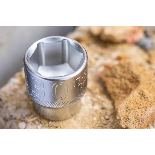 STANLEY FMMT17246-0 socket, silver metal, close-up angle on rough stone surface.