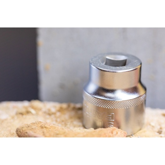 STANLEY FMMT17247-0 socket tool, metallic finish, close-up, shown on a sandy surface.