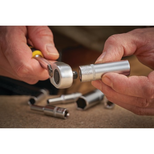 STANLEY FMMT17523-0 socket being attached to ratchet wrench, close-up hands, tool photography.