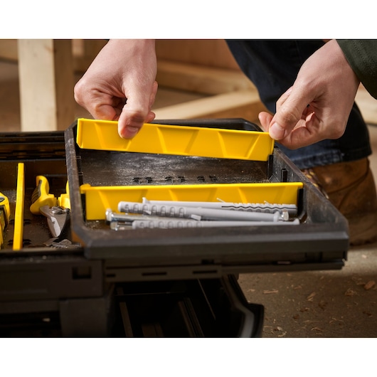 STANLEY FMST1-71219 toolbox tray with yellow dividers and assorted tools, close-up angle.