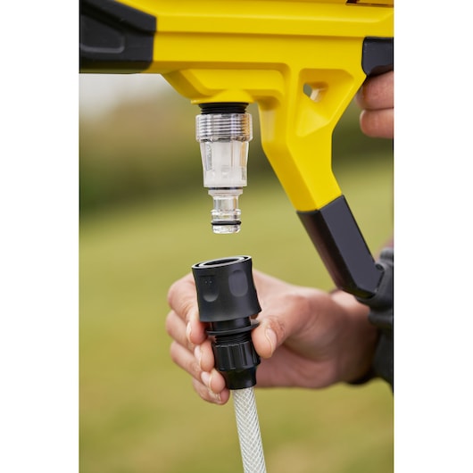 STANLEY SFMCPC93M1 connector with yellow body and hose close-up outdoors, product photography