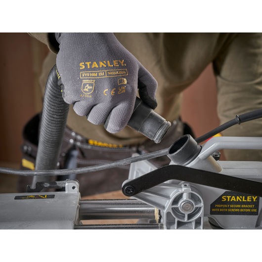 STANLEY SM1800 photography of gloved hand connecting hose to machine, close-up angle.