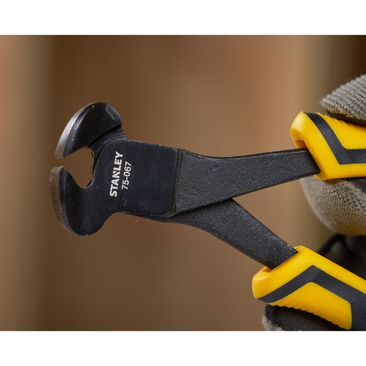 STANLEY STHT0-75067 end cutting pliers with yellow and black handles, close-up view.