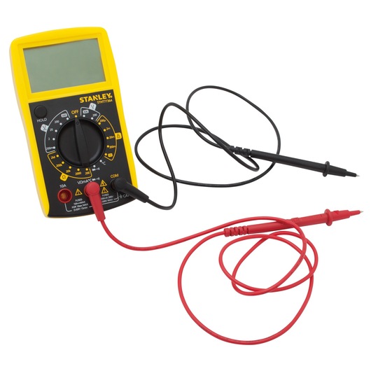 Photo of STANLEY STHT0-77364 digital multimeter with yellow casing, large display, and red and black test leads, front angle.