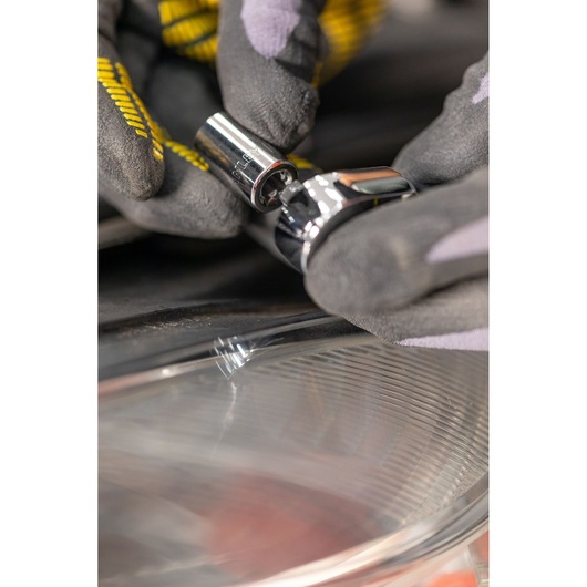 STANLEY STMT82663-0 socket being attached to a ratchet by gloved hands, close-up photography.