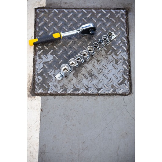 STANLEY STMT82666-0 ratchet and socket set photographed on metal surface.