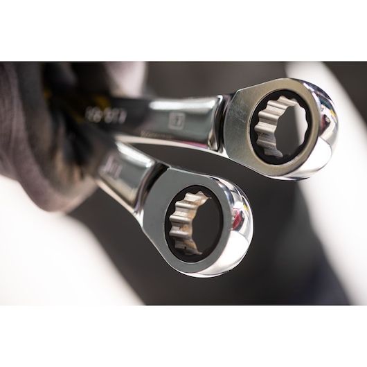 STANLEY STMT82846-0 ratcheting wrenches close-up view, chrome finish, held in gloved hand.