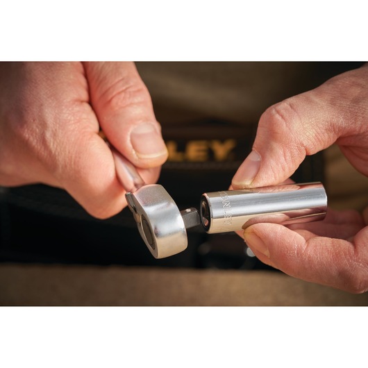 STANLEY STMT86094-0 socket and ratchet tool held in hands, close-up photography.