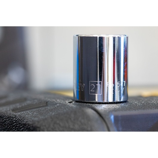 STANLEY STMT86103-0 chrome socket 27mm, close-up, photography on tool surface.