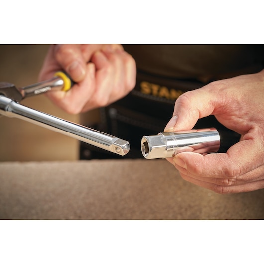 STANLEY STMT88941-0 socket and ratchet tool held in hands, close-up photography with yellow handle.