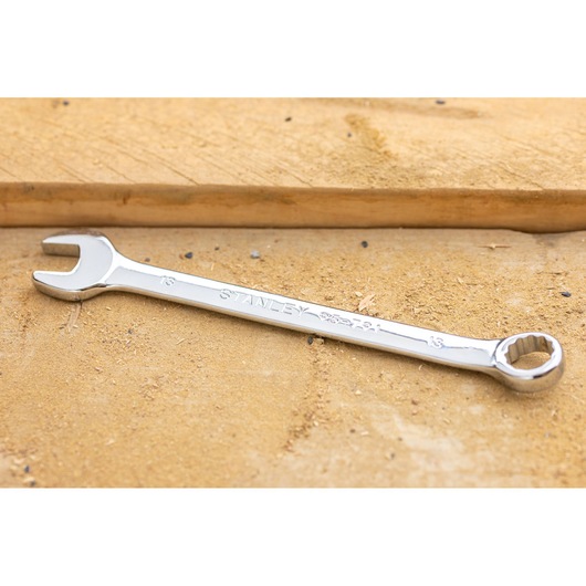 STANLEY STMT95909-0 combination wrench, silver, photography, angled on a wooden surface.