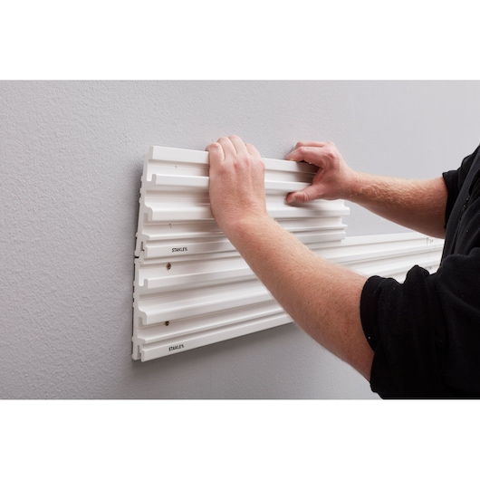 Stanley STST82602-1 wall panel installation, white slat panel, product photography, front angle.