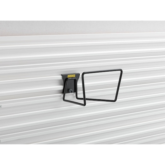Photo of STANLEY STST82604-1 black metal wall bracket on white grooved panel, side angle.