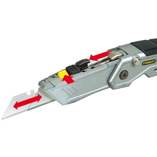 STANLEY XTHT0-10502 utility knife close-up showing blade and slider mechanism with red arrows.